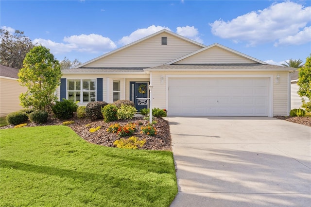 ranch-style home featuring a front yard and a garage