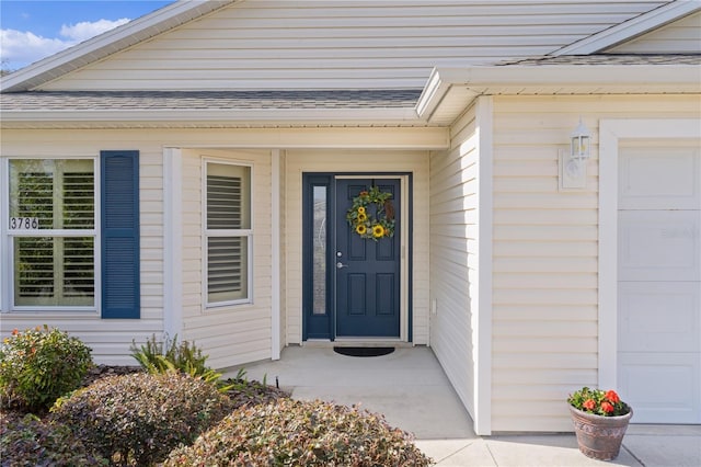 doorway to property featuring a garage