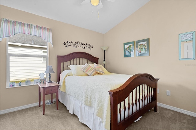 carpeted bedroom featuring vaulted ceiling and ceiling fan