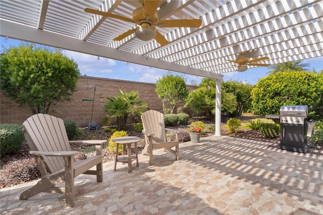 view of patio / terrace with ceiling fan, a grill, and a pergola