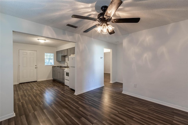 kitchen with gray cabinetry, ceiling fan, white electric range oven, dark hardwood / wood-style flooring, and a textured ceiling