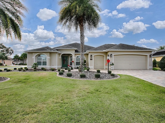 view of front of home featuring a front lawn and a garage