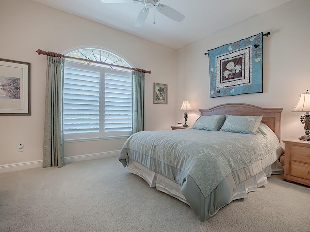 bedroom featuring ceiling fan, baseboards, and carpet flooring