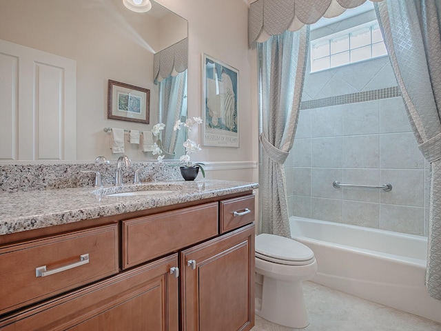 full bathroom featuring shower / bath combo with shower curtain, vanity, and toilet