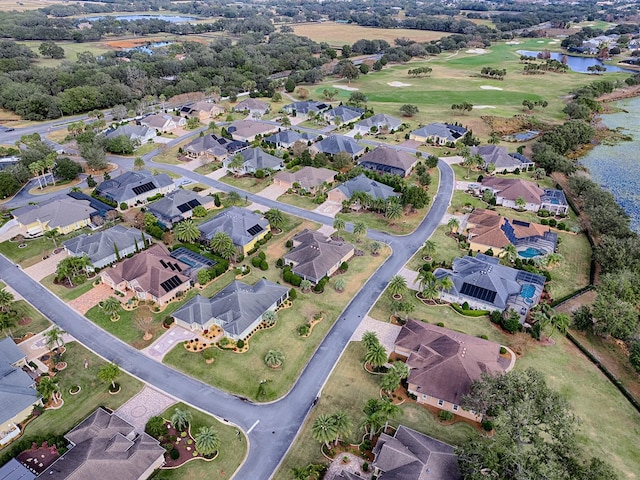 bird's eye view with a water view and a residential view