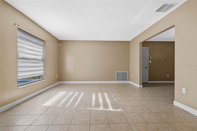 view of tiled spare room