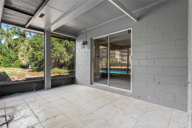 unfurnished sunroom featuring a healthy amount of sunlight