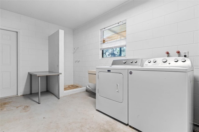 washroom featuring washing machine and dryer