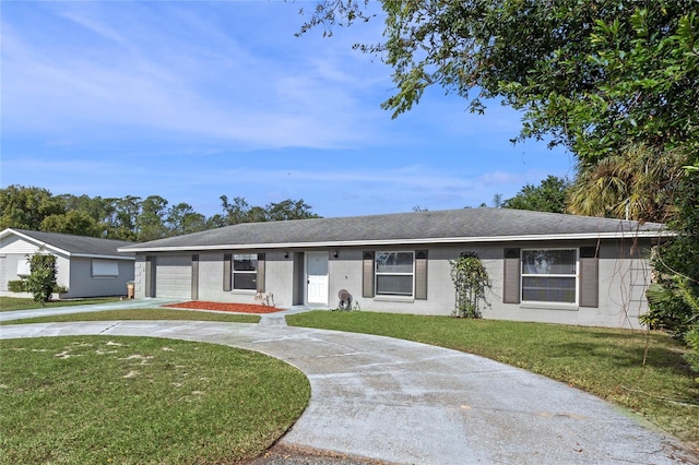 ranch-style home with a garage and a front lawn