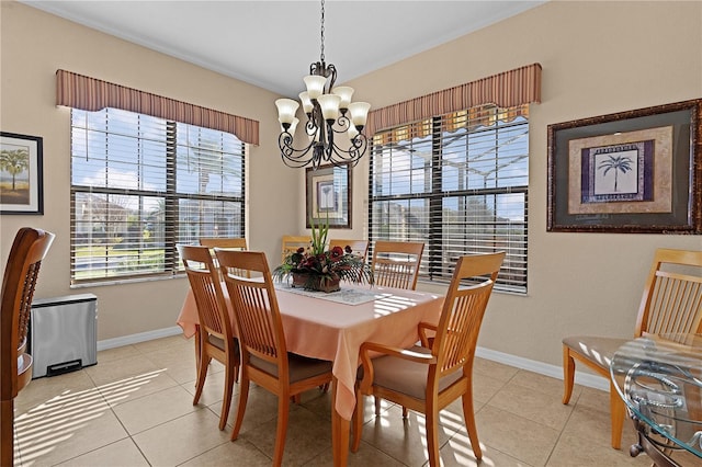 tiled dining area featuring a notable chandelier