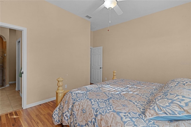 bedroom with ceiling fan and wood-type flooring