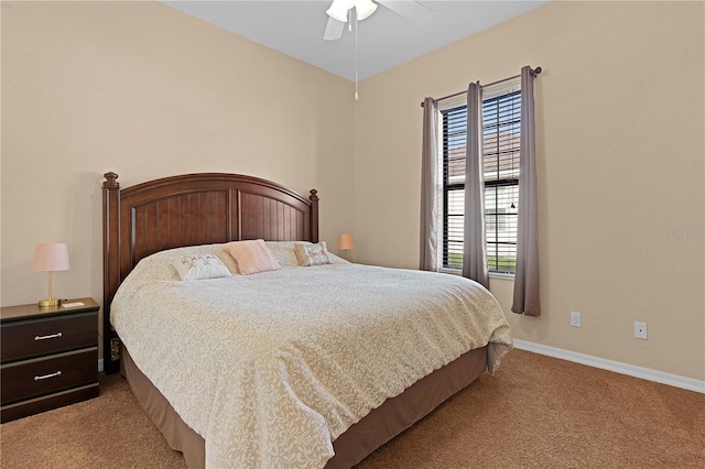 bedroom featuring multiple windows, ceiling fan, and light colored carpet