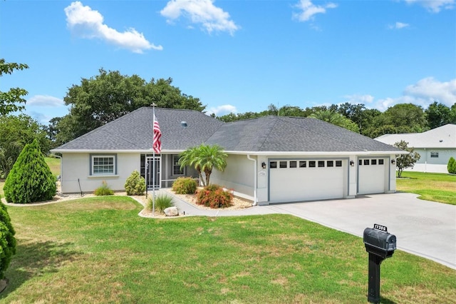 ranch-style home featuring a front lawn and a garage