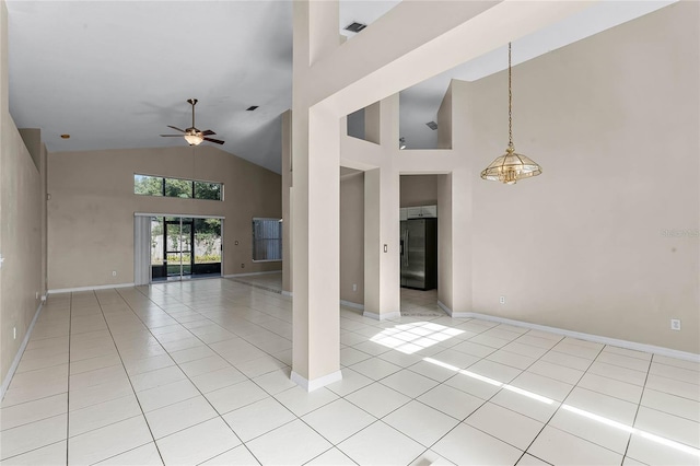 interior space with light tile patterned floors, high vaulted ceiling, and ceiling fan