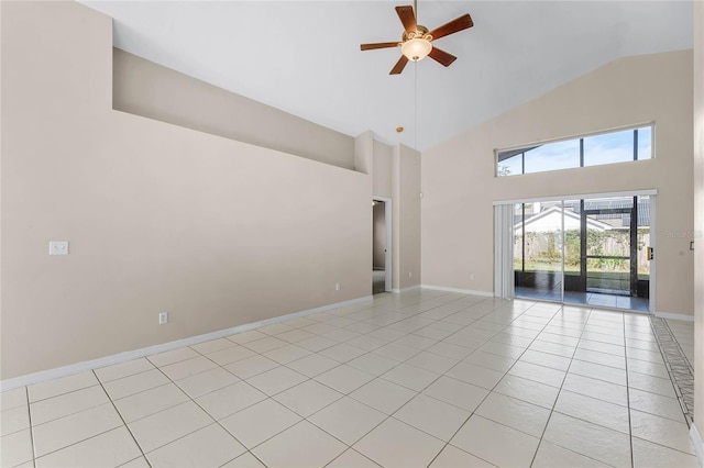 tiled spare room featuring ceiling fan and lofted ceiling