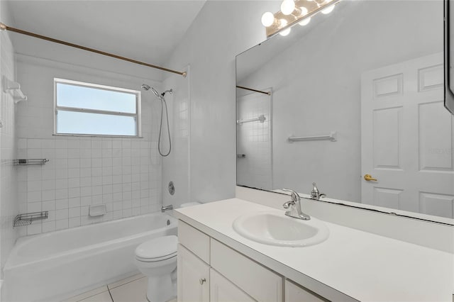 full bathroom featuring tile patterned flooring, vanity, tiled shower / bath combo, and toilet