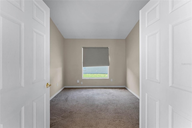 empty room with carpet flooring