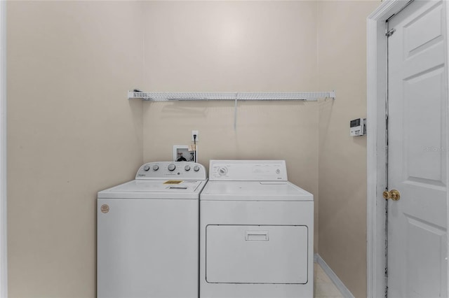 laundry room with independent washer and dryer