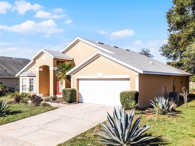 ranch-style house featuring a garage and a front lawn