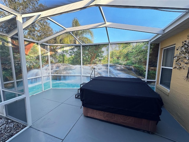 exterior space featuring pool water feature and glass enclosure