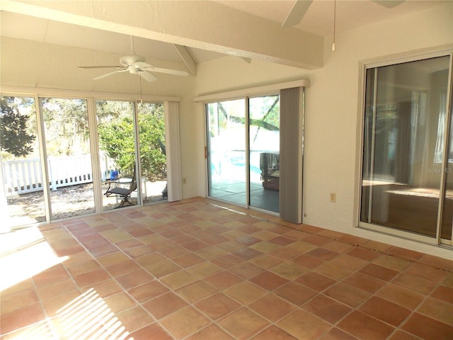 unfurnished sunroom with lofted ceiling with beams and a ceiling fan