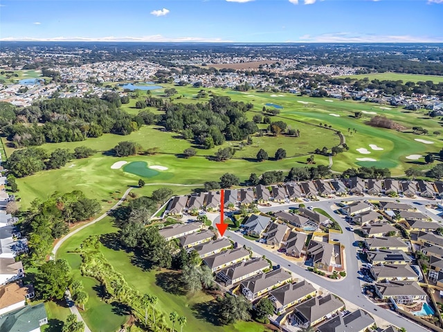 drone / aerial view with a residential view and view of golf course