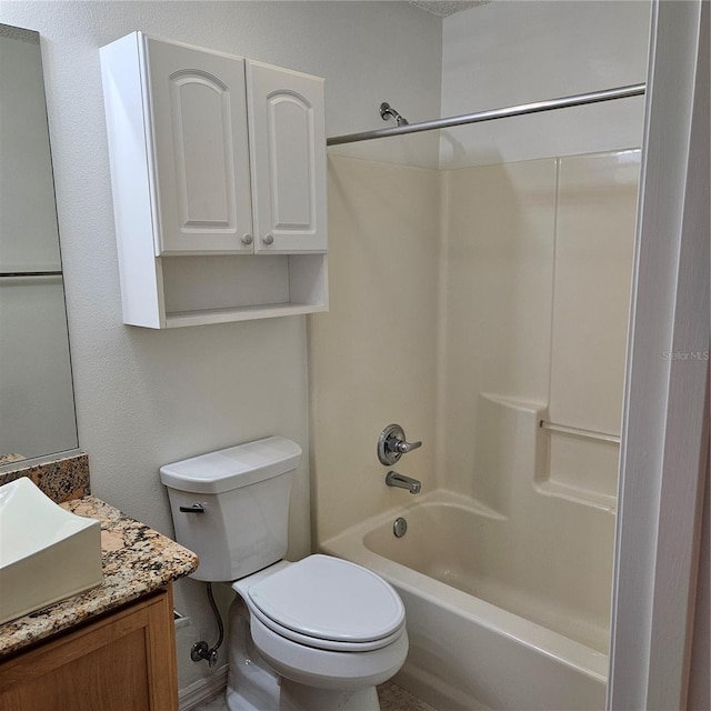 bathroom featuring toilet,  shower combination, and vanity