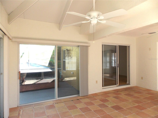 unfurnished sunroom featuring visible vents, beam ceiling, and a ceiling fan