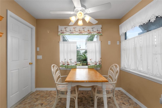 dining space featuring ceiling fan