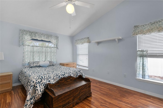 bedroom featuring dark hardwood / wood-style floors, vaulted ceiling, and ceiling fan