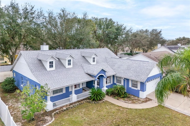 view of front of property featuring a garage and a front yard