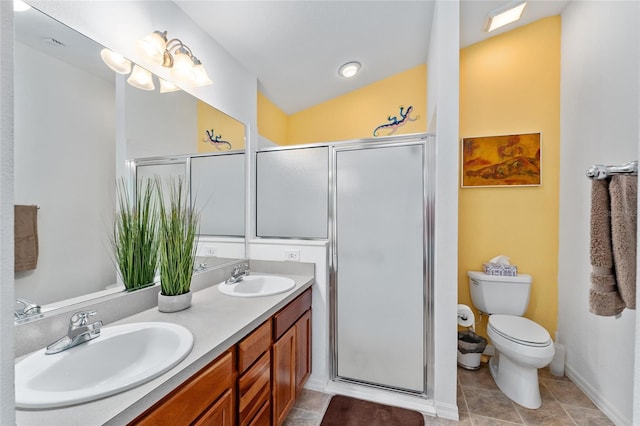 bathroom with vanity, lofted ceiling, tile patterned floors, toilet, and walk in shower