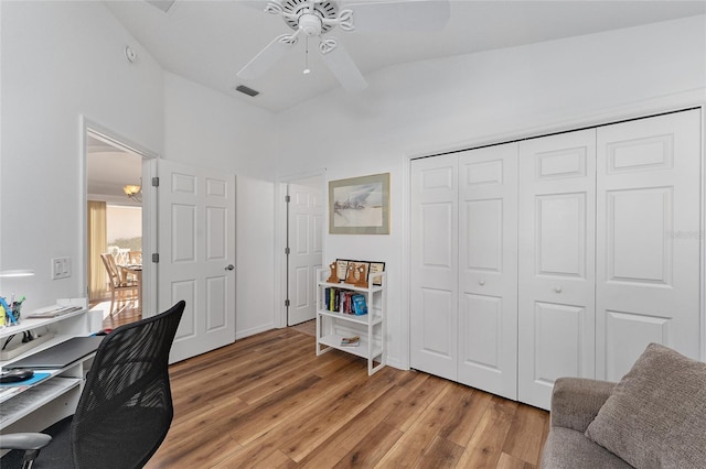 office with hardwood / wood-style floors, ceiling fan, and lofted ceiling