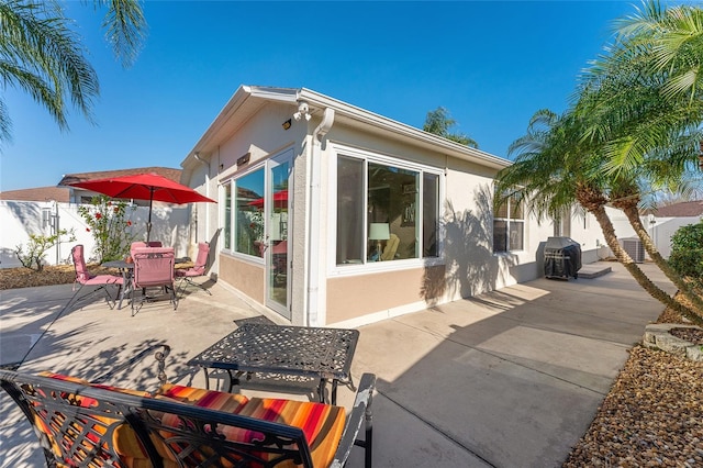 rear view of property with a patio area