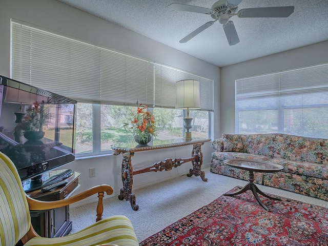 interior space featuring a textured ceiling and ceiling fan