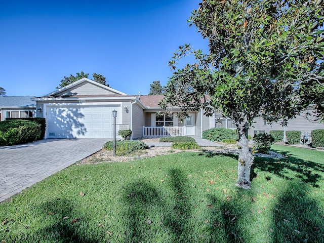 ranch-style home with a porch, a garage, and a front yard