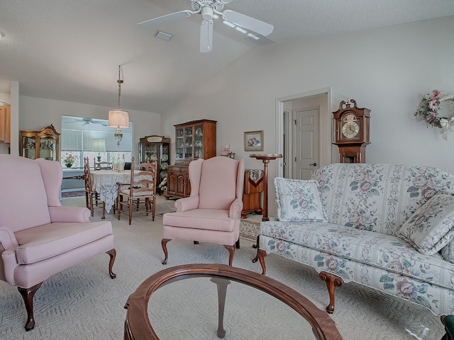 carpeted living room featuring vaulted ceiling