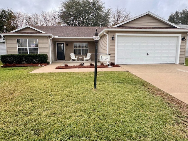 ranch-style house with a garage and a front yard