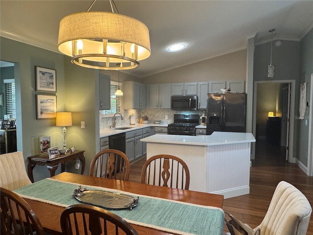 kitchen featuring gray cabinetry, backsplash, lofted ceiling, black appliances, and sink