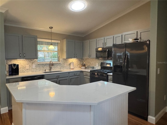 kitchen featuring black appliances, a kitchen island, sink, dark hardwood / wood-style floors, and vaulted ceiling