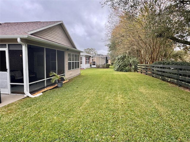 view of yard featuring a sunroom