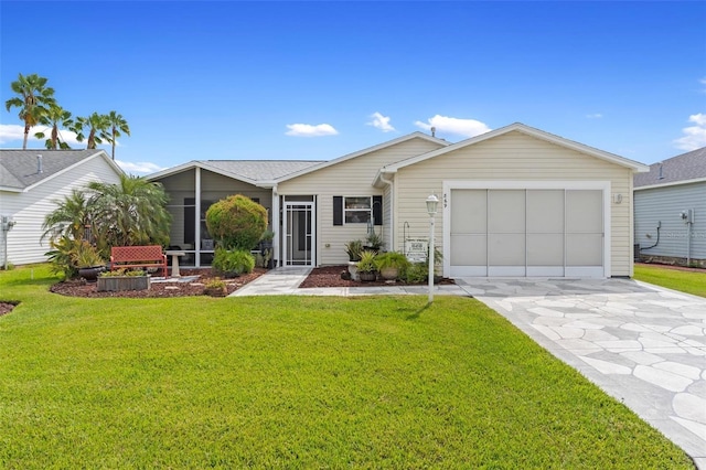 single story home with a sunroom, a front lawn, and a garage