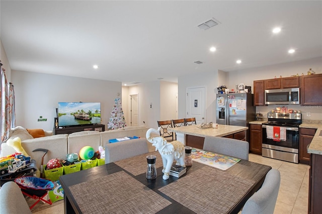 dining room with light tile patterned floors