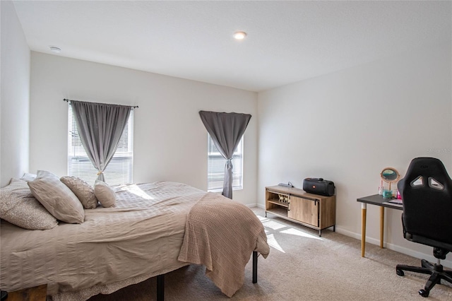 bedroom with light colored carpet