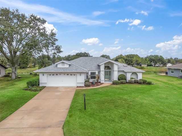 ranch-style home with a front yard and a garage