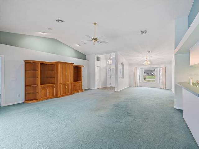 unfurnished living room with carpet, high vaulted ceiling, and ceiling fan