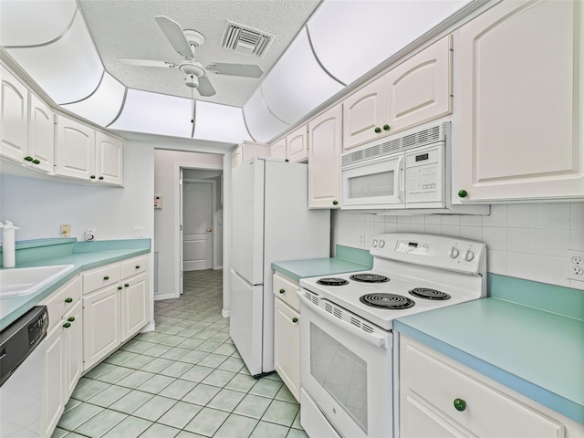 kitchen with ceiling fan, white cabinetry, decorative backsplash, and white appliances