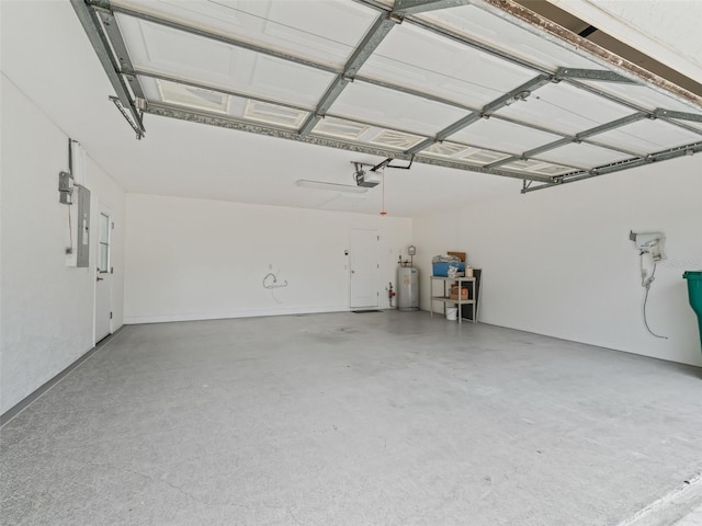 garage featuring electric panel, electric water heater, and a garage door opener