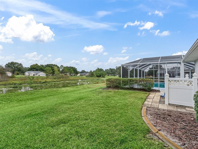 view of yard with glass enclosure