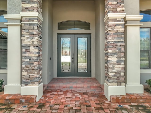 property entrance featuring french doors